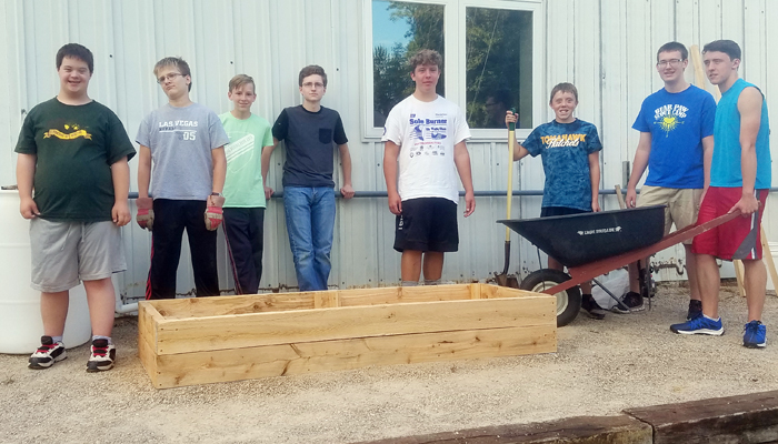 Boy Scouts who helped install the raised garden beds behind New London's Mission of Hope House in August were, from left, Thomas Mercer, Mitchell White, Nathan Reeseman, Adam Reimer, Devin Lederhaus, Wyatt Lederhaus, Adam Steckbauer and Austin Lederhaus.
Photo courtesy of Lori Prahl